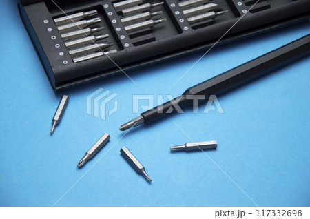 Small hand screwdriver with interchangeable tips, screwdriver for DIY work. 117332698