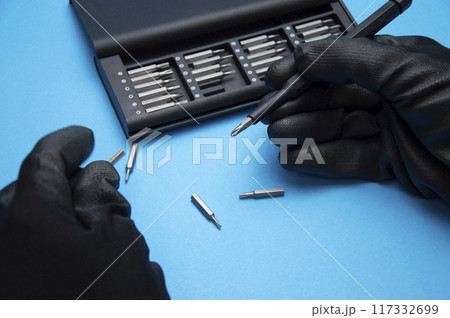 Small hand screwdriver with interchangeable tips, screwdriver for DIY work. Small hand screwdriver with interchangeable tips, screwdriver for DIY work. 117332699