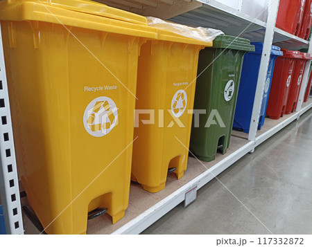 Trash cans of various colors separate types of garbage. Trash cans of various colors separate types of garbage. 117332872