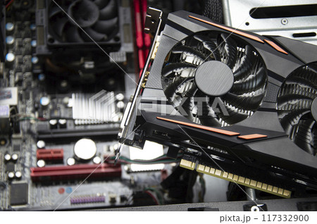Top view of graphics card and motherboard. 117332900