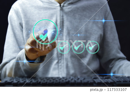 service guarantee, Validation concept for business process automation, quality assurance management, certification, digital transformation. businessman touching checked icon on virtual screen. service guarantee, Validation concept for business process automation, quality assurance management, certification, digital transformation. businessman touching checked icon on virtual screen. 117333107