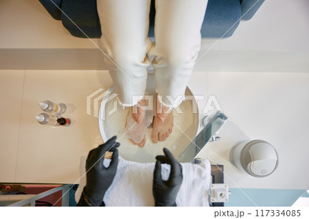 Bath for legs before pedicure procedure at spa beauty salon 117334085