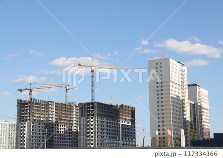 Construction site background. Cranes and new high rise buildings. Industrial background. 117334166