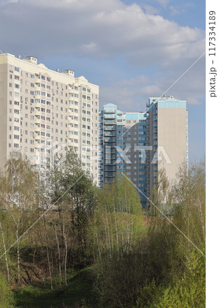 Sleeping area with high-rise buildings on a sunny spring day, Vidnoe, Moscow region, May 2022. Sleeping area with high-rise buildings on a sunny spring day, Vidnoe, Moscow region, May 2022. 117334189