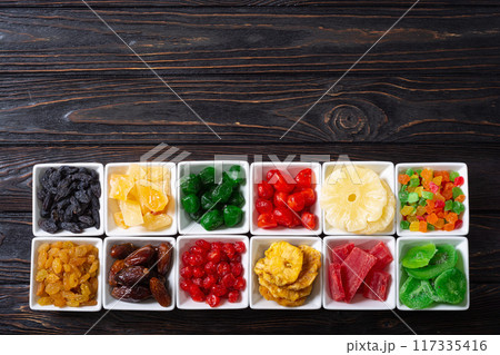 Group of dried and candied fruit in bowl 117335416