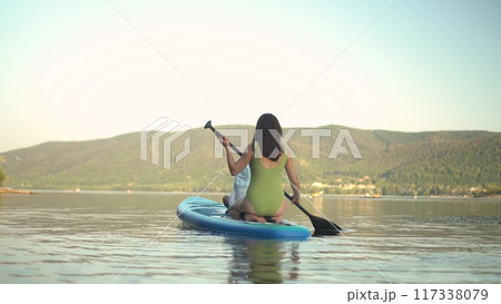 Experience a Serene and Thrilling Kayaking Adventure on a Calm and Beautiful Lake Experience a Serene and Thrilling Kayaking Adventure on a Calm and Beautiful Lake 117338079