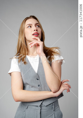 Concerned Young Woman deep in thought or contemplation Concerned Young Woman deep in thought or contemplation 117341006