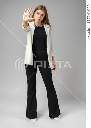 Young Woman Making Stop Sign With Hand Young Woman Making Stop Sign With Hand 117341090
