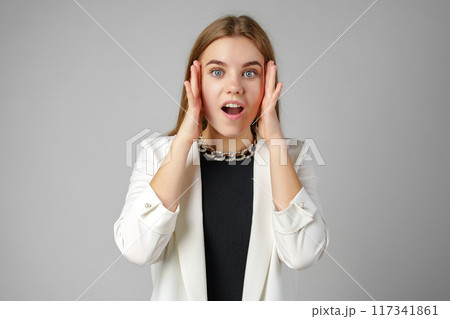 Excited Young Woman in Stylish Outfit Surprised Expression Excited Young Woman in Stylish Outfit Surprised Expression 117341861