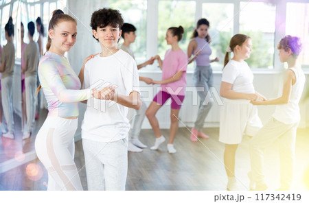 Teenage boy and girl dancing waltz Teenage boy and girl dancing waltz 117342419