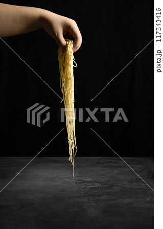 noodles in hand noodles in hand 117343416