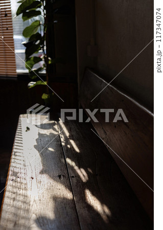 Empty tables of indoor  restaurant. blank wooden coffee table with blurred restaurant interior background. 117347074