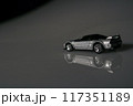 This charming toy car rests on the table, serving as a delightful reminder of simpler times 117351189