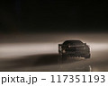 Even in the darkness, this toy car sparks imagination, reminding us of adventurous journeys yet to come. 117351193