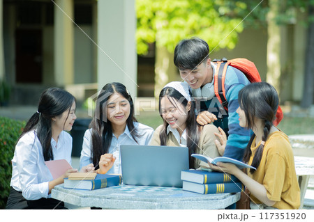 Group of students studying on campus outdoors Group of students studying on campus outdoors 117351920