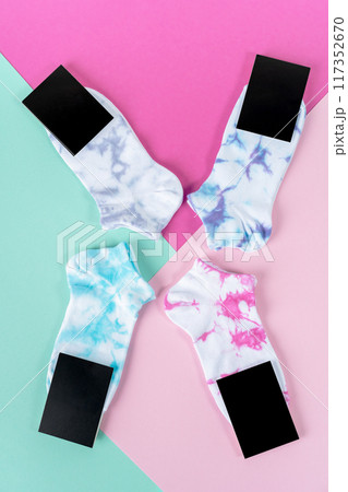 Tie dye socks. Different color socks with label. advertising, logo, branding. Socks with black label for your design. Mock up Tie dye socks. Different color socks with label. advertising, logo, branding. Socks with black label for your design. Mock up 117352670