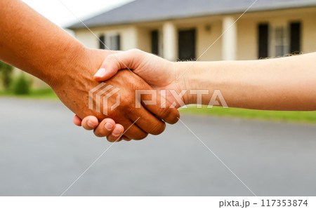 Handshake front house, real estate agreement success, property deal sealed handshake, homeownership transfer 117353874