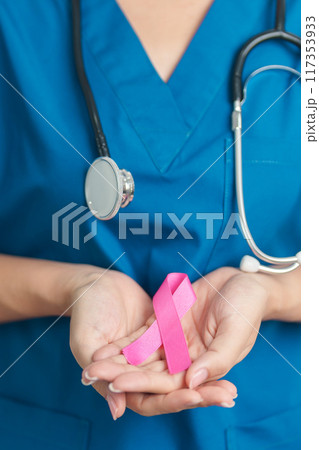 Pink October Breast Cancer Awareness month, woman doctor with pink Ribbon in hospital for support people life and illness. National cancer survivors month, Mother and World cancer day concept 117353933