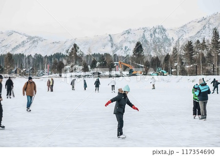excitement and beauty of winter tourism, families spending quality time together ice skating and other winter sports excitement and beauty of winter tourism, families spending quality time together ice skating and other winter sports 117354690