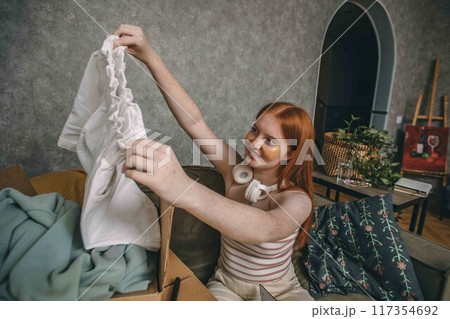 Eco-friendly Endeavors: Repurposing with a Smile, Showcasing the joy and responsibility of recycling old clothes Eco-friendly Endeavors: Repurposing with a Smile, Showcasing the joy and responsibility of recycling old clothes 117354692