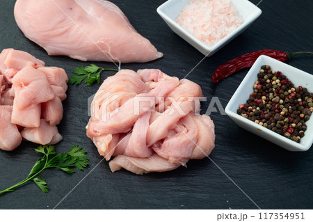 Raw chicken meat fillet ( breast ) Various of cutting in form slice and cube 117354951