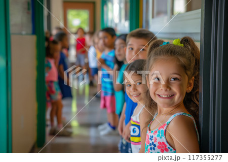 Group of cheerful students waits in line along a bright school corridor 117355277