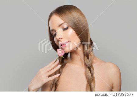 Attractive young healthy woman with pigtail hairstyle and natural make-up on white background Attractive young healthy woman with pigtail hairstyle and natural make-up on white background 117355577