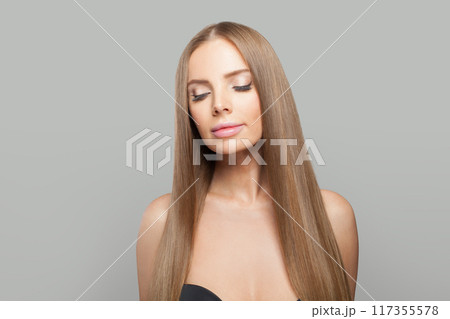 Nice model. Woman with long brown hair, natural makeup and healthy clean skin Nice model. Woman with long brown hair, natural makeup and healthy clean skin 117355578