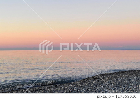Tranquil nature background. Pastel pink and blue color sea and sky Tranquil nature background. Pastel pink and blue color sea and sky 117355610