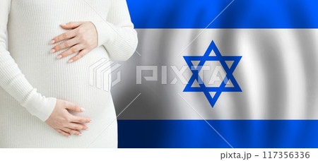 Demographics and pregnancy in Israel concept. Pretty pregnant woman belly Demographics and pregnancy in Israel concept. Pretty pregnant woman belly 117356336