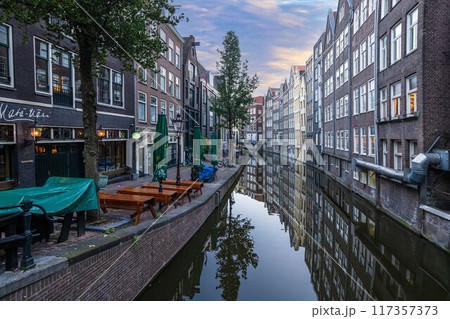 View over a typical canal in the Dutch metropolis Amsterdam in summer 2023 117357373