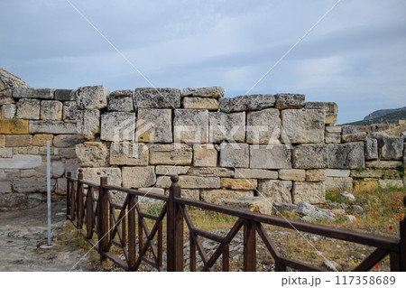walls of the ancient ruins of limestone blocks. Ruins of the city of Hierapolis, Turkey. walls of the ancient ruins of limestone blocks. Ruins of the city of Hierapolis, Turkey. 117358689