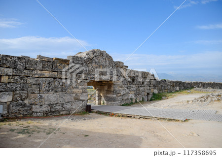 walls of the ancient ruins of limestone blocks. Ruins of the city of Hierapolis, Turkey. walls of the ancient ruins of limestone blocks. Ruins of the city of Hierapolis, Turkey. 117358695