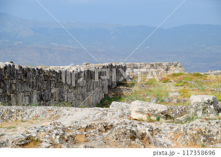 walls of the ancient ruins of limestone blocks. Ruins of the city of Hierapolis, Turkey. 117358696