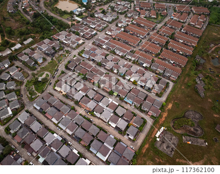 Aerial view of residential houses and driveways neighborhood during a fall sunset or sunrise time.Tightly packed homes.Top view over building houses in phuket thailand Aerial view of residential houses and driveways neighborhood during a fall sunset or sunrise time.Tightly packed homes.Top view over building houses in phuket thailand 117362100