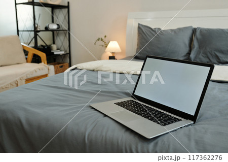 Laptop On Bed In The Bedroom Laptop On Bed In The Bedroom 117362276