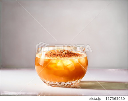 Caramel Delight Rich golden cocktail in a coupe glass garnished with a sprinkle of cinnam 117363080