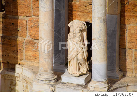 Marble statues at the columns of the amphitheater in Hierapolis, Turkey. Marble statues at the columns of the amphitheater in Hierapolis, Turkey. 117363307
