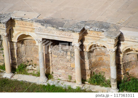 Antique columns and arches in the Hierapolis amphitheater. 117363311