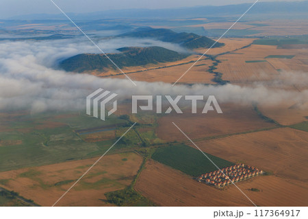 Aerial view of the mountains and fields in Bulgaria. View from a plane 117364917