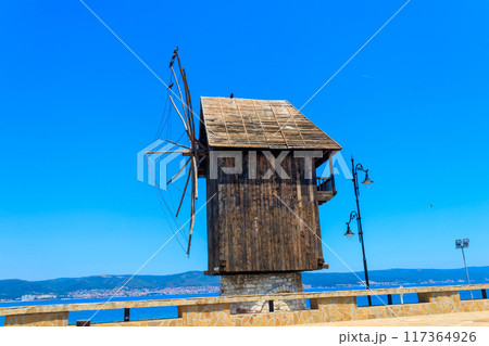 Old wooden windmill in the old town of Nessebar, Bulgaria 117364926
