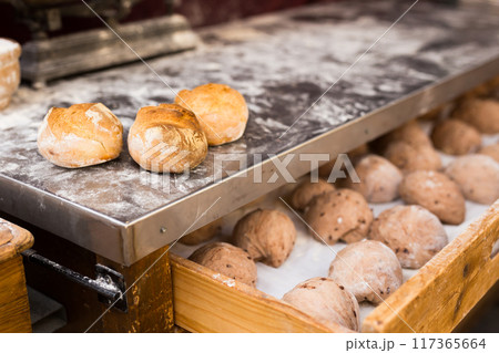 Ruddy buns made from fresh warm grain bread after baking Ruddy buns made from fresh warm grain bread after baking 117365664
