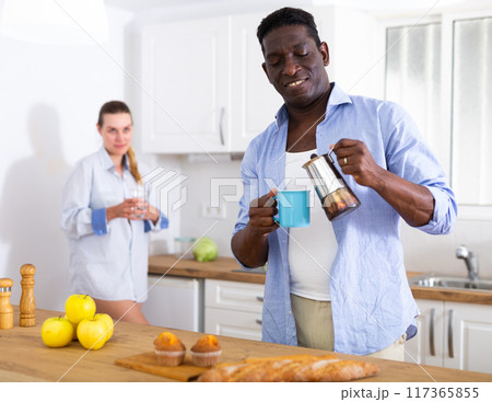 Husband and wife having breakfast together at home Husband and wife having breakfast together at home 117365855