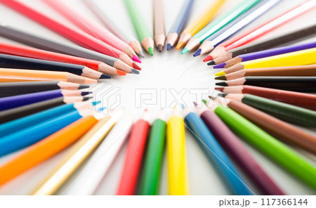 colored pencils lying around the heart colored pencils lying around the heart 117366144