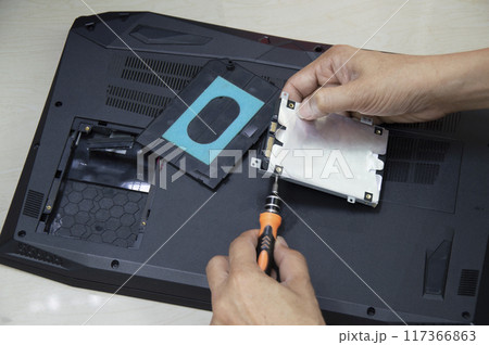 Top view, technician wearing Hard disk, computer repair Top view, technician wearing Hard disk, computer repair 117366863