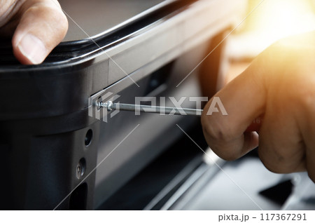Screwdriver tightens the screws. repair tools Mechanic or engineer tools Screwdriver tightens the screws. repair tools Mechanic or engineer tools 117367291