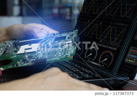The concept of a technician using an electrical system analysis program and checking the motherboard. 117367373