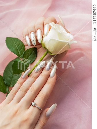 Female Hands with beautiful pearl manicure 117367440