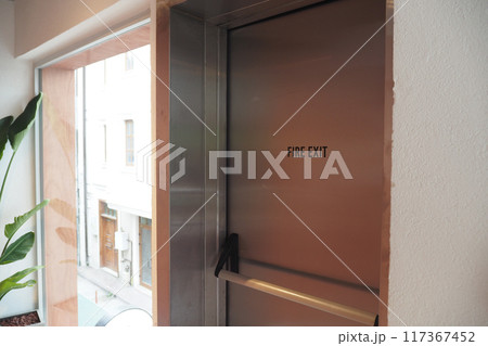 Emergency Exit Door in a building . 117367452