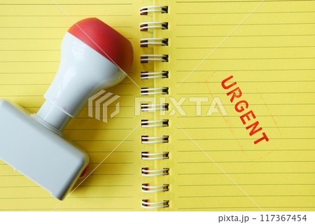 Red URGENT word stamp on a white paper  117367454